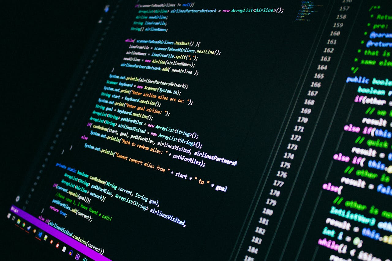 Services Close-up of colorful programming code on a computer screen, showcasing digital technology.